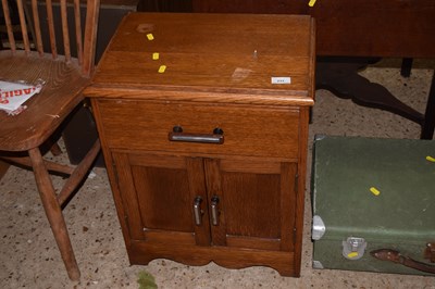 Lot 233 - An early 20th Century oak bedside cabinet