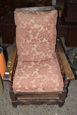 Lot 253 - An early 20th Century oak framed recliner...