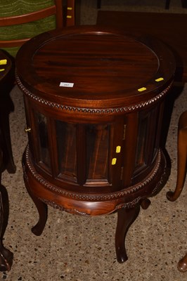 Lot 257 - A reproduction circular hardwood drinks...