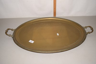 Lot 504 - An oval brass serving tray