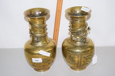 Lot 550 - A pair of Chinese brass vases with dragon...