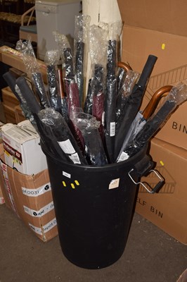 Lot 696 - A plastic dustbin containing as new umbrellas