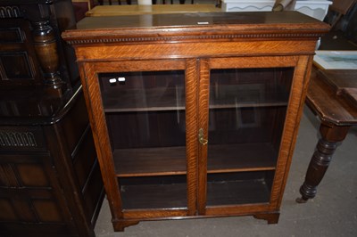 Lot 736 - An early 20th Century oak bookcase cabinet...