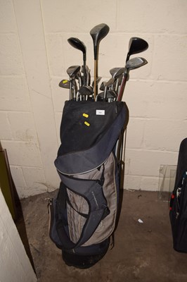 Lot 751 - A golf bag containing various clubs to include...