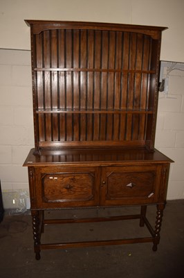 Lot 754 - An oak dresser on barley twist legs
