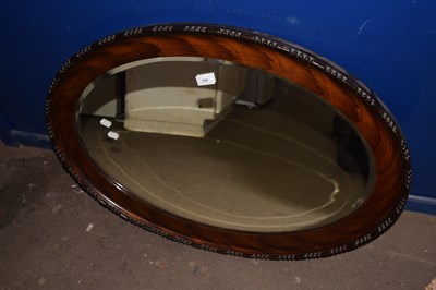 Lot 757 - An Edwardian oval wall mirror in hardwood frame