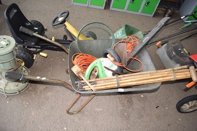 Lot 299 - A wheelbarrow containing vintage drain rods,...