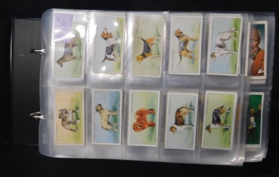 Lot 564 - Modern cigarette card album containing 14 full...