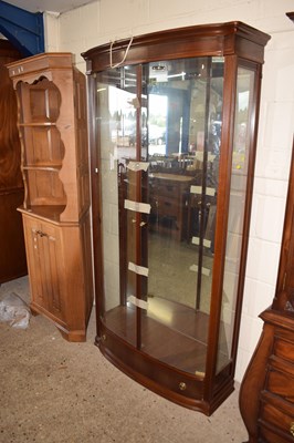 Lot 223 - A modern mahogany finish bow front glazed...