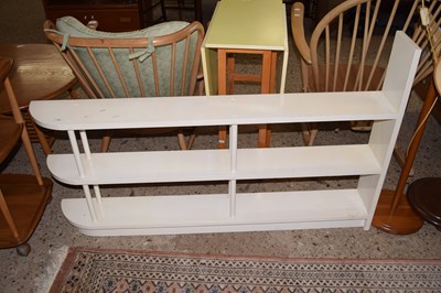 Lot 239 - A gloss painted three tier bookcase