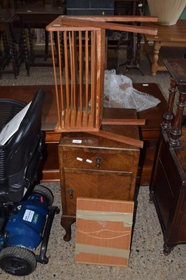 Lot 260 - An oak veneered bedside cabinet, a small plant...