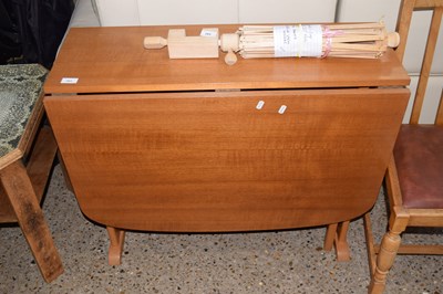Lot 263 - A drop leaf teak finish dining table