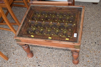 Lot 266 - An Indian hardwood coffee table with glass top