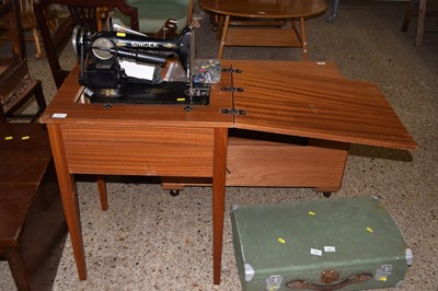 Lot 274 - A Singer sewing machine with stand and...