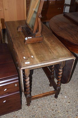 Lot 308 - An oak dining table on barley twist legs
