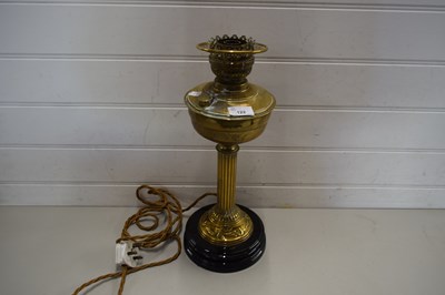 Lot 122 - VICTORIAN BRASS BASED OIL LAMP LATER CONVERTED...