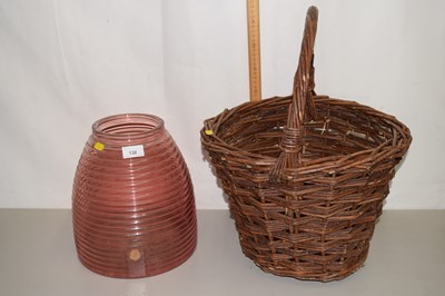 Lot 138 - A small glass barrel and a wicker basket