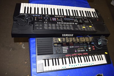 Lot 586 - A Yamaha PSS-590 electronic keyboard together...