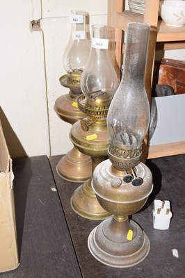 Lot 604 - Three various vintage oil lamps