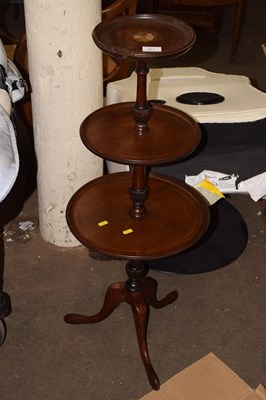 Lot 671 - A mahogany three tier dumb waiter with tripod...