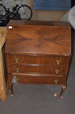 Lot 688 - A walnut veneered bureau