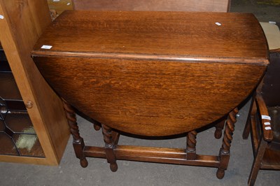 Lot 697 - Early 20th Century oak dining table on barley...