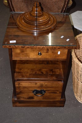 Lot 705 - A modern bedside cabinet with glass top...