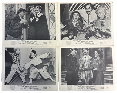 Lot 119 - A set of eight studio-issued black and white...