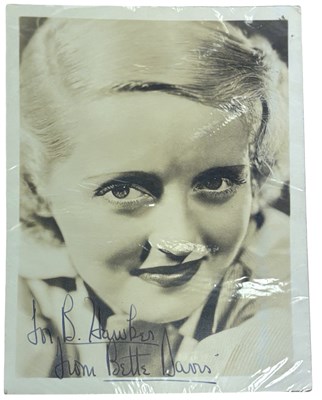 Lot 104 - A black and white headshot bearing the...