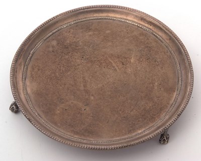 Lot 1 - A George III silver waiter of plain circular...