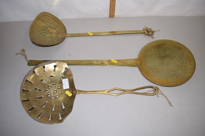 Lot 15 - Group of three brass dairy skimmers