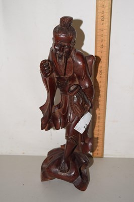 Lot 54 - A Chinese carved hardwood figure