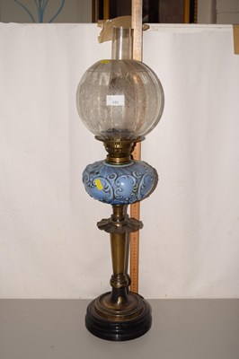 Lot 151 - An oil lamp with pale glass font