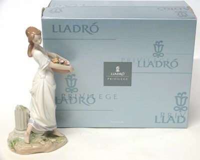 Lot 256 - A boxed Lladro figure of lady with flowers,...
