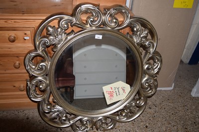 Lot 246 - A decorative wall mirror with pierced floral...