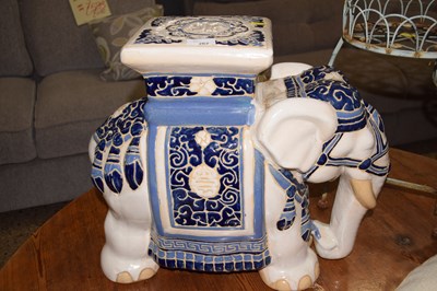 Lot 262 - A porcelain elephant formed jardiniere stand