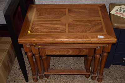Lot 308 - An as new nest of three hardwood tables