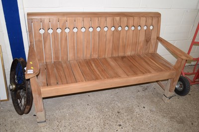 Lot 357 - A modern teak garden bench with pierced...
