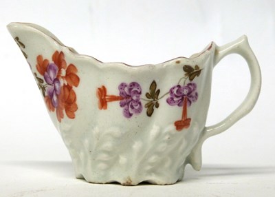 Lot 275 - A Lowestoft porcelain Low Chelsea ewer creamer...