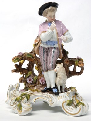 Lot 282 - A 19th Century porcelain group of a Shepherd...