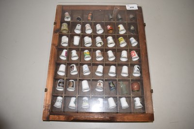 Lot 650 - A case of collectors thimbles