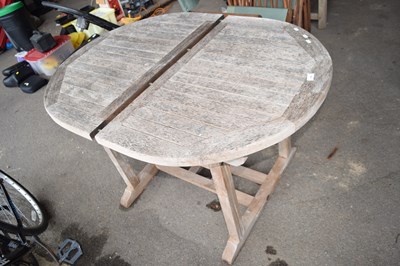 Lot 376 - A wooden garden table