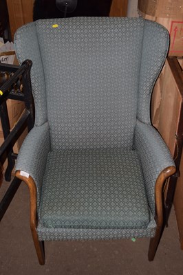Lot 773 - A wing back armchair