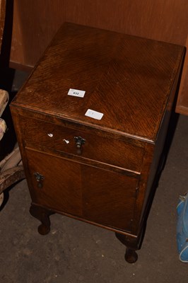 Lot 832 - An oak veneered bedside cabinet