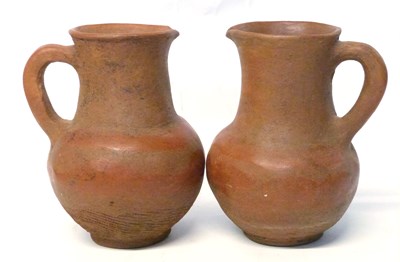 Lot 331 - A pair of East African terracotta jugs with...