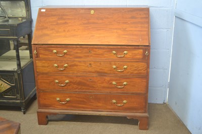 Lot 340 - A Georgian mahogany bureau with four drawers...