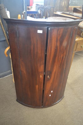 Lot 347 - A Georgian mahogany bow front two door wall...