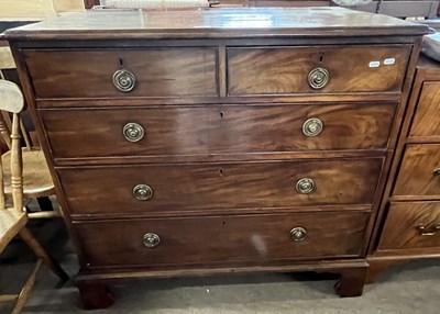 Lot 385 - A late Georgian mahogany chest of two short...
