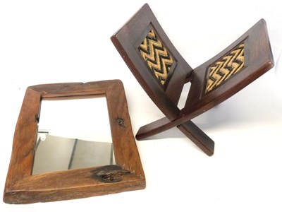 Lot 387 - An East African hardwood book stand together...
