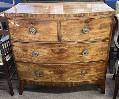 Lot 402 - A Georgian mahogany bow front chest, two short...